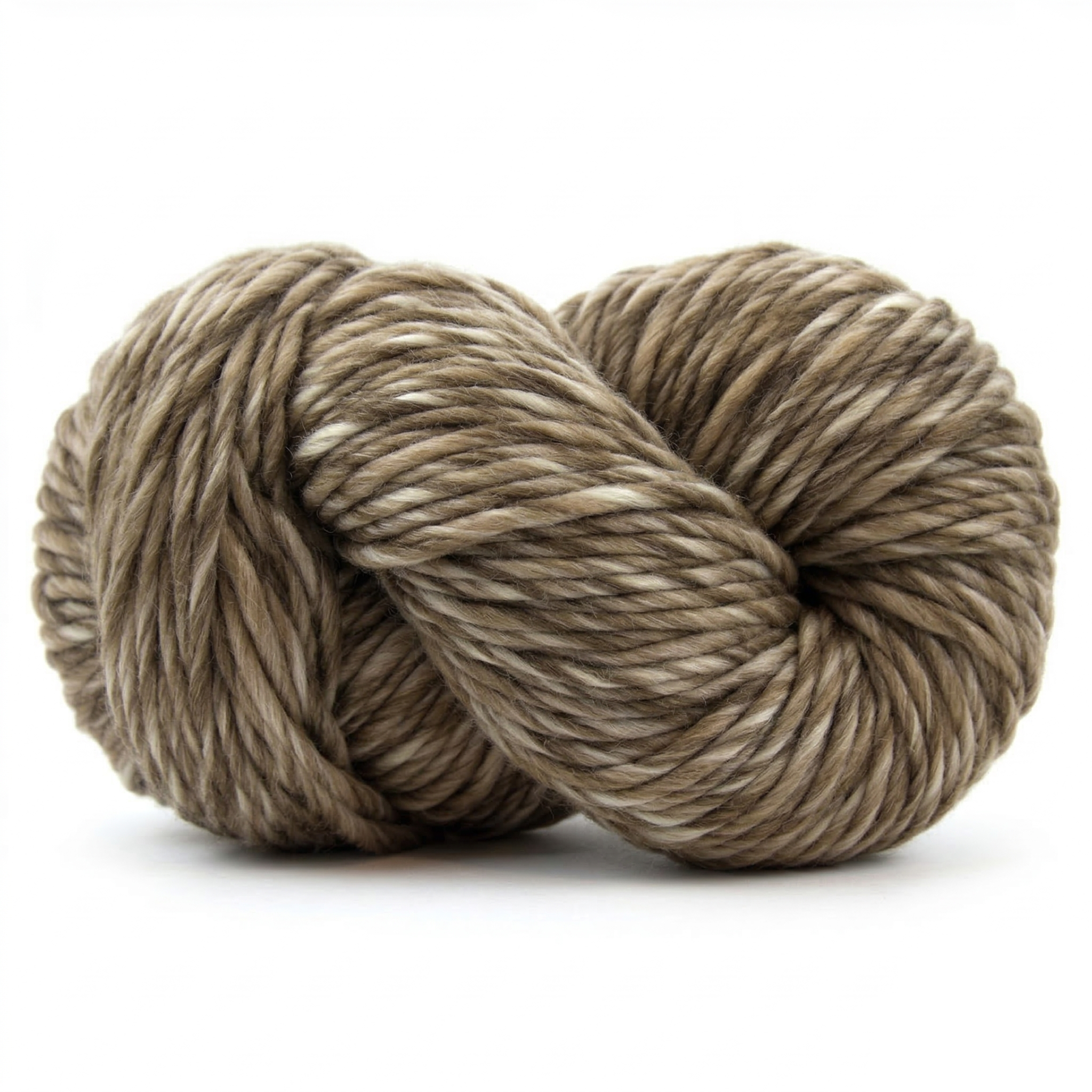 Humbug Gray super bulky multicolor merino wool yarn skein in a soft twisted pose on a light neutral background.