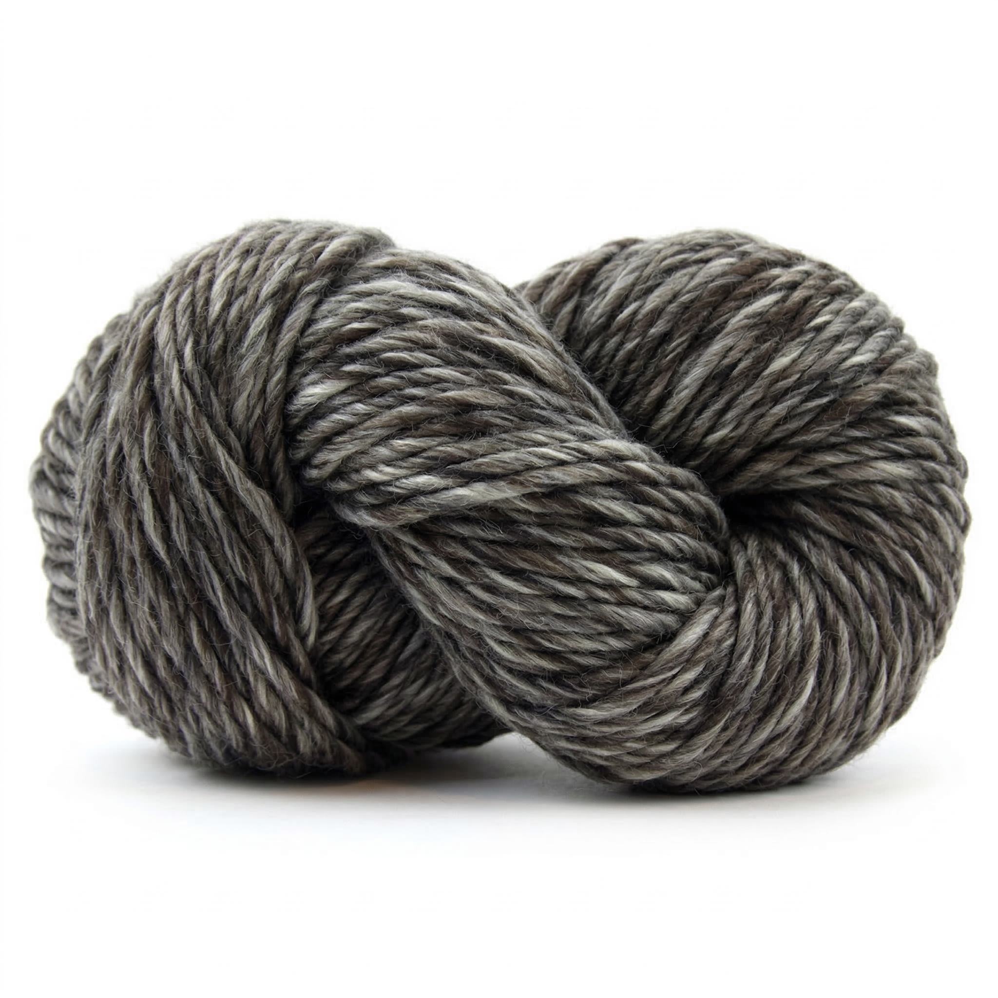 Humbuggier Gray super bulky multicolor merino wool yarn skein in a soft twisted pose on a light neutral background.
